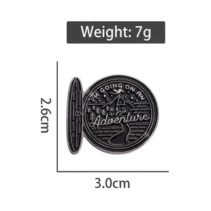 Pin's aventure en émail et alliage noir argenté, dimensions de 3,0 cm x 2,6 cm