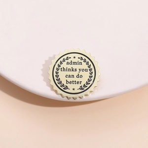 Macro view of golden gear edge enamel badge with Admin Thinks You Can Do Better text
