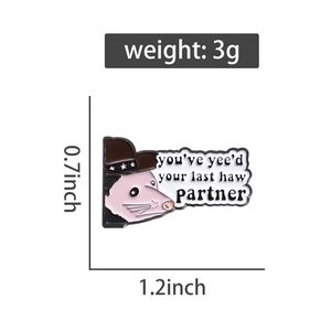 Detail of cute opossum enamel pin with cowboy hat showing 0.7x1.2 inch size specs