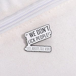 Minimalist white enamel pins on white canvas bag featuring black funny quote text