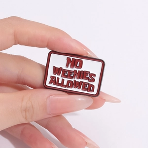 Minimalist red and white enamel pin with No Weenies Allowed text in a rectangle shape