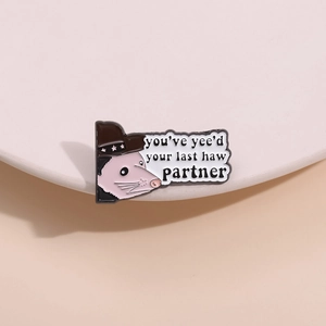Funny cowboy opossum enamel pin with 'you've yee'd your last haw' quote design