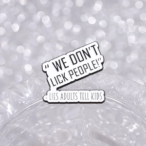 Funny enamel pin featuring We Don't Lick People text on a high-quality metal brooch