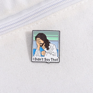 Macro detail of enamel pin with Facepalm Jesus and I Didn't Say That text slogan