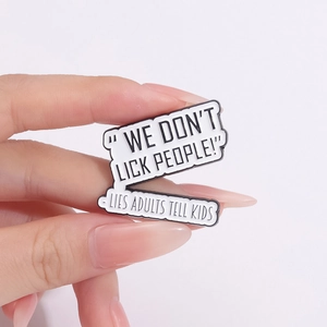 Funny enamel speech bubble pin with We Don't Lick People text for clothing accessories