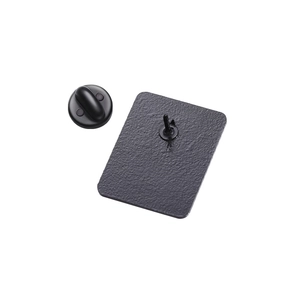 Detailed back view of matte black metal brooch with durable rubber clutch fastener