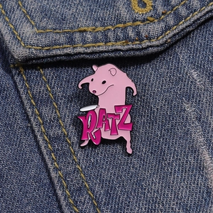 Funny pink naked mole rat enamel pin badge with RATZ text on blue denim jacket