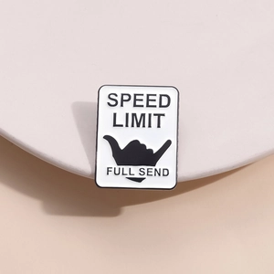 Minimalist SPEED LIMIT enamel pin with black letter printing and Shaka sign on metal badge