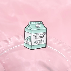 Creative mint green milk carton enamel pin with Math Student Tears slogan on water background