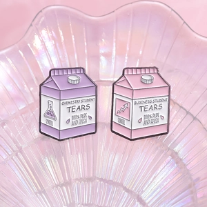 Creative milk carton enamel pins featuring Chemistry and Business Student Tears design