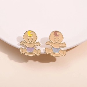 Adorable twin baby cartoon enamel pins in gold metal with purple glitter diaper detail