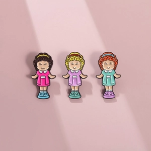 Set of three cute cartoon girl enamel pins with colorful hair and metal finish