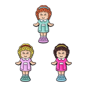 Three colorful cartoon girl enamel pins with retro dresses and vintage hairstyles