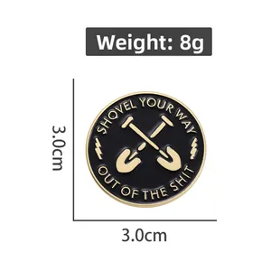 Detailed close-up of 3.0cm round enamel pin featuring crossed shovels and quote design