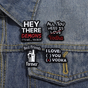 Enamel pin set with humorous meme text on blue denim jacket background