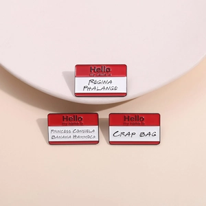 Three enamel pins featuring iconic Friends character quotes on name tag designs