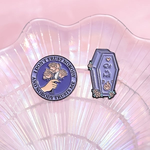 Gothic purple enamel pin set with raven and coffin designs for Halloween accessories