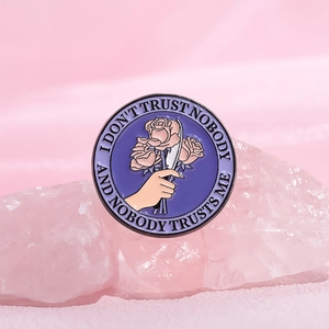 Purple enamel badge with hand holding pink roses and dagger for Halloween jewelry