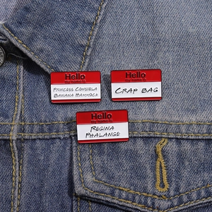 Three Friends TV show enamel pins set with character aliases on a blue denim jacket