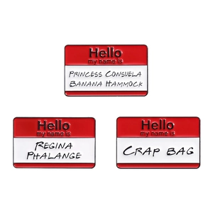Three enamel pins with Friends theme red and white name tag designs on white background