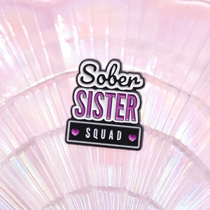Creative enamel pin badge featuring Sober SISTER SQUAD text on purple pearl tray