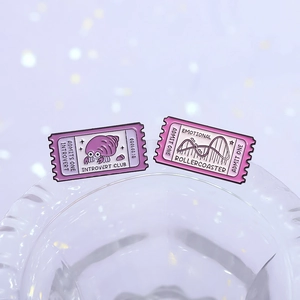 Set of enamel pins featuring Introvert Club hermit crab and Emotional Rollercoaster motifs
