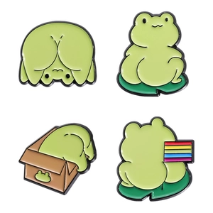 Set of four cute cartoon frog enamel pins with rainbow flag and leaf on white background