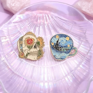 Artistic oil painting style enamel pins featuring sunflower skull and Starry Night coffee cup