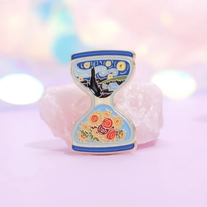 Artistic hourglass enamel pin featuring Van Gogh Starry Night and Sunflower design
