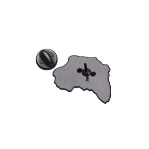 Macro shot of Africa map pin back with secure black rubber clutch on metal base
