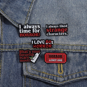 Retro horror movie enamel pins set including vintage text slogans and cinema icons