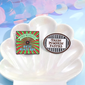 Creative enamel pin set featuring Fred Weasleys Blaze Box and Fresh Pumpkin Pasties design