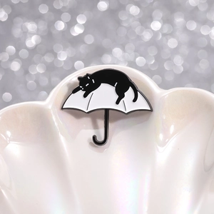 Cartoon enamel cat sleeping on white umbrella brooch pin made of durable alloy