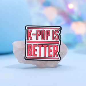 K-POP IS BETTER enamel pin with red lettering on white background for clothing