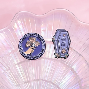 Gothic purple enamel pin set with rose dagger and coffin on iridescent shell tray