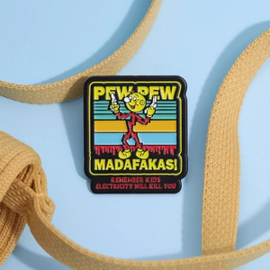 Colorful cartoon enamel pin with lightning character and electricity safety warning text