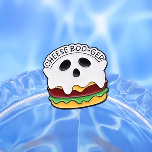Cute ghost burger enamel pin with Cheese Boo-ger text on a blue wave background