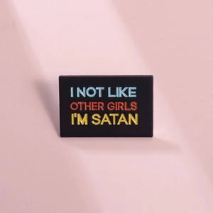 Black enamel pin with colorful 'I'M SATAN' text on a pink purple background