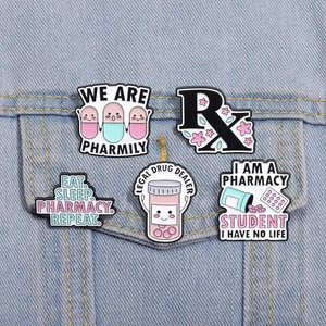 Close-up of pharmacist enamel pins with funny quotes pinned on blue denim jacket pocket
