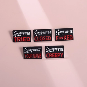 Five-piece set of geometric black enamel brooches with humorous Sorry slogan designs