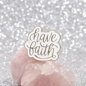 Minimalist cloud-shaped enamel brooch with have faith gold lettering on pink stone
