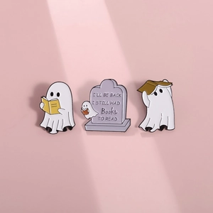 Three-piece set of cute ghost enamel pins reading books on light purple background