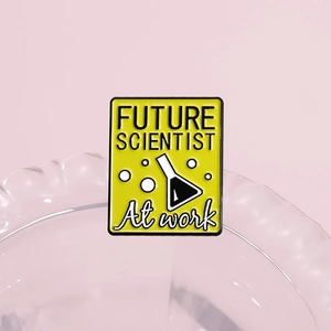 Cartoon enamel pin with yellow 'FUTURE SCIENTIST' design and science beaker graphics