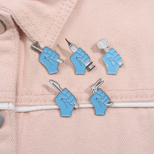 Set of 5 medical enamel pins featuring light blue gloved hands with tools on denim