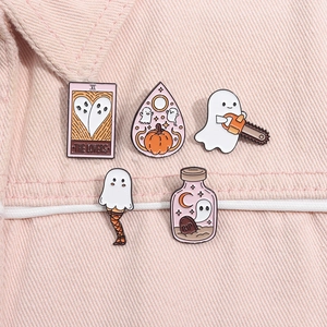 Set of five Halloween ghost enamel pins featuring tarot cards and spooky designs on denim