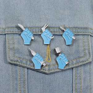 Close-up of five blue medical enamel pins with syringe and scalpel on denim jacket