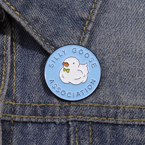 Cartoon enamel pin featuring a silly goose on denim jacket collar, round lapel badge