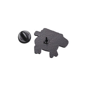 Detail of the black metal brooch back with secure rubber clutch and textured finish