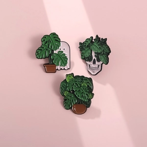 Three-piece punk enamel pins featuring ghost, skull, and frogs with monstera plants