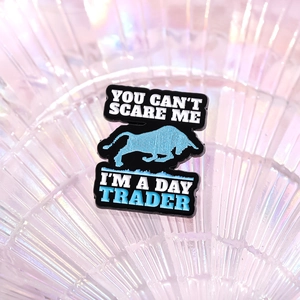 Bull day trader enamel pin with 'You Can't Scare Me' quote on iridescent glass tray
